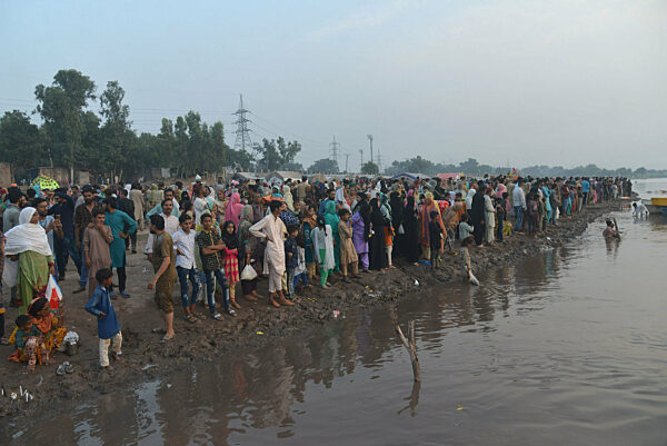 Pakistani devotees gather with symbolic paper boats an offering to Muslim saint Sheikh Abdul Qadir Jilani