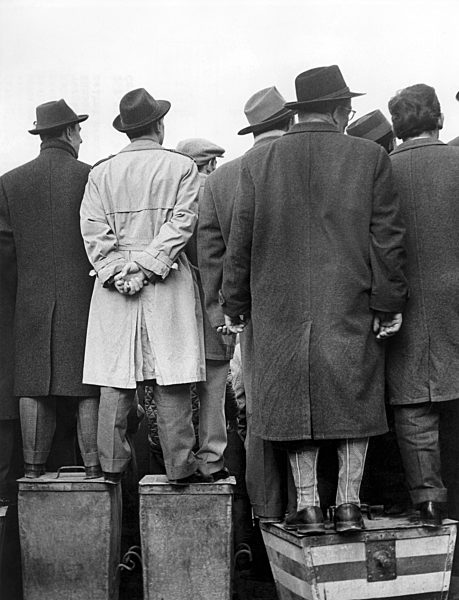 Soccer fans on boxes