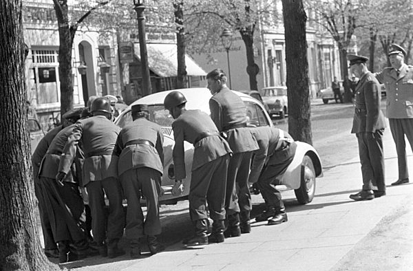 Soldiers carry car