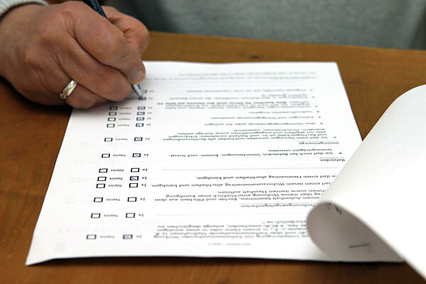 A Woman Fills Out A Form