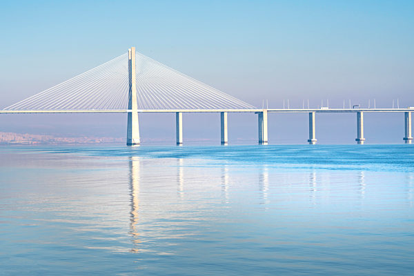 The Vasco da Gama Bridge is a cable-stayed bridge that spans the Tagus River in Parque das Navßvµes in Lisbon