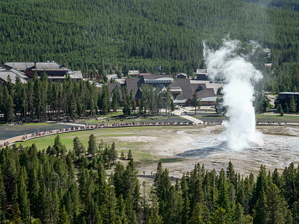 The cone geyser called Old Faithful erupting in Yellowstone National Park, Wyoming, USA.