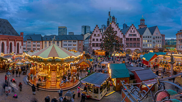 View of carousel and stalls on Christmas Market stalls at dusk, Roemerberg Square, Frankfurt am Main at dawn, Hesse, Germany, Europe