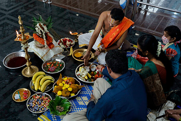 Sri Srinivasa Perumal hindu temple. Hindu priest ( Brahmin ) performing puja ceremony and rituals. Singapore.