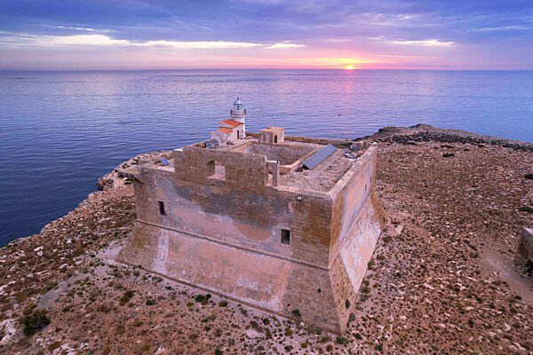 Aerial view of the fortified tower with the light house built on top of Capo Passero island at sunrise, Capo Passero island, Portopalo di Capo Passero municipality, Siracusa province, Sicily, Italy, Mediterranean, Europe