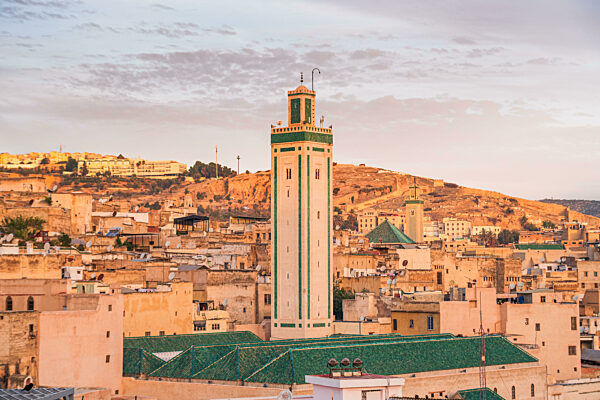 Warm yellow sunrise over the Medina of Fes, Morocco Kairaouine Mosque of Fes