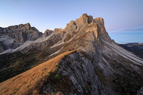 Hiker admires the rocky peaks Furcella De Furcia Odle Funes Valley South Tyrol Dolomites Trentino Alto Adige Italy Europe