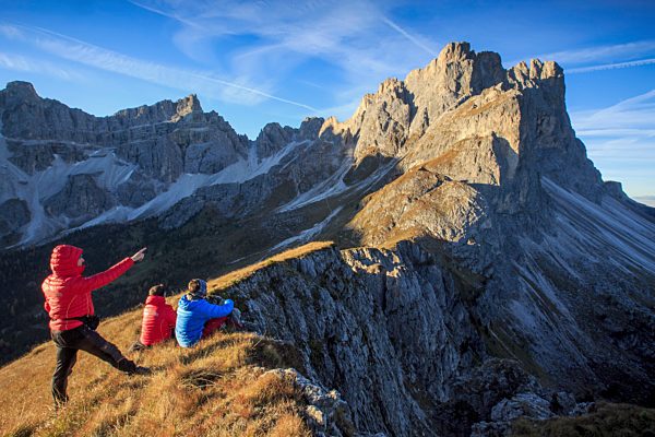 Hikers admire the rocky peaks Furcella De Furcia Odle Funes Valley South Tyrol Dolomites Trentino Alto Adige Italy Europe