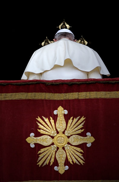 Pope Francis delivers the Urbi et Orbi (to the city and to the world) Christmas Day message from the central balcony of St. Peter's Basilica in Vatican City, 25 December 2013