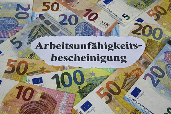 Geldscheine und Arbeitsunfaehigkeitsbescheinigung