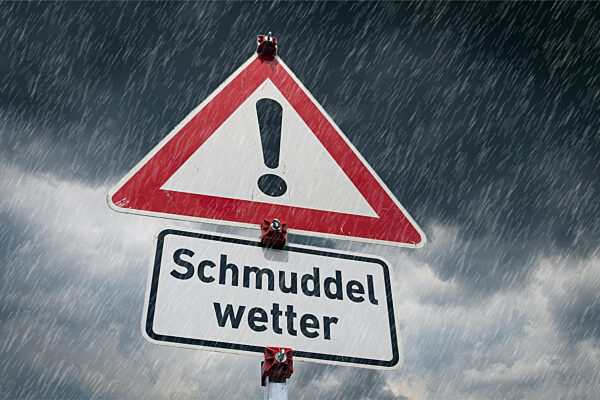 Symbolisches Warnschild Schmuddelwetter