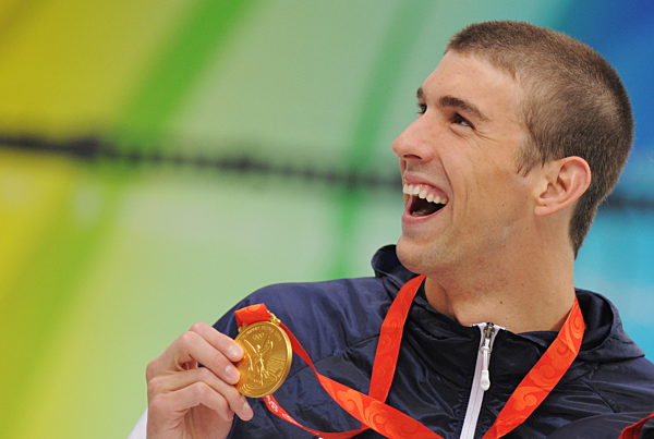 Goldmedallist Michael Phelps celebrates on the podium during the medal...