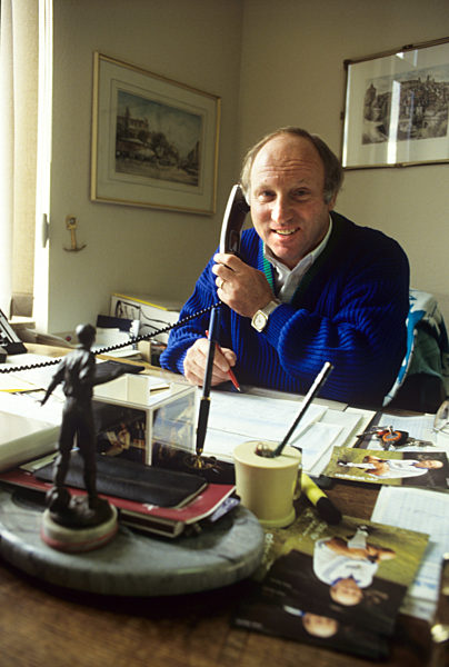 Uwe Seeler on the phone in his office
