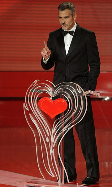 U.S. actor George Clooney delivers a speech during the German telethon "Ein...