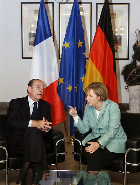 French President Jacques Chirac and German Chancellor Angela Merkel sit down...