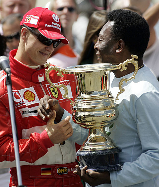 German Formula One driver Michael Schumacher (L) of Scuderia Ferrari F1 team...