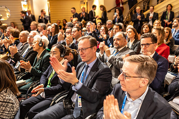 Engaged Audience Applauding at a High-Level Conference