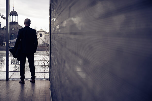 Contemplation Amidst the Skyline: A Moment of Reflection