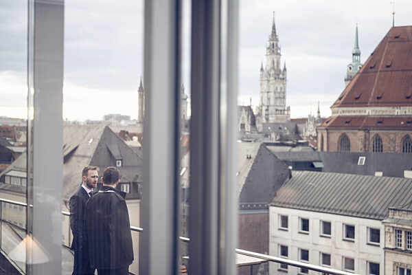 Diplomatic Exchange Overlooking Munich's Historic Skyline