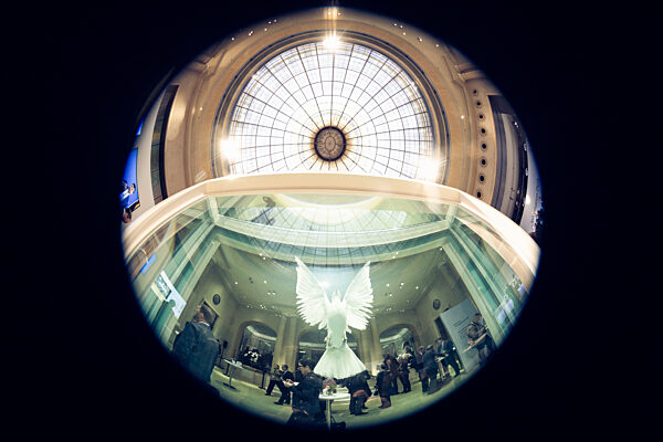 Illuminated Dove Sculpture Under Majestic Dome