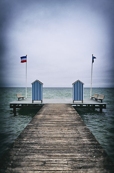 Pier jetty ocean changing cabins blue stripped