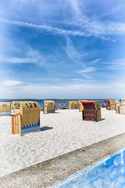 Summer hooded beach chairs sand sunshine blue sky