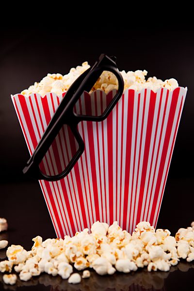 3D Glasses hanging on a box full of popcorn