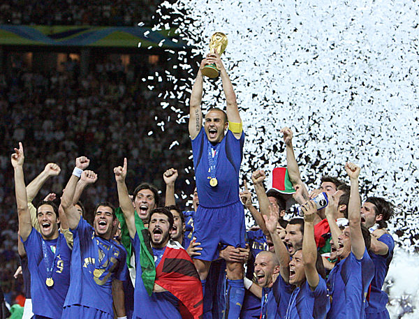Italian team with captain Fabio Cannavaro (C) celebrates with the World Cup...